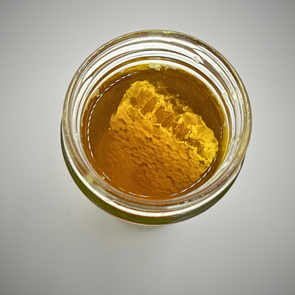 Miel 100% brut avec morceaux de rayons de miel (375 ml)